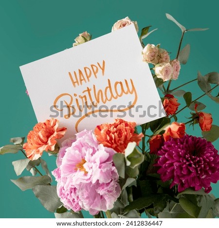 The image is a sign with the word "HAPPY" written on it and decorated with flowers. The word "Birthday" is also written below "HAPPY".