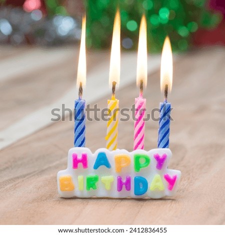 The image is a group of candles arranged in a row. The content of the image is "HAPPY BIRTHD." It is tagged as candle, birthday, wax, birthday candle, birthday cake, and candle holder.