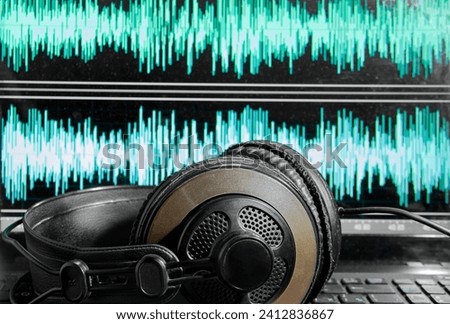 Headphones and monitor with spectrogram of sound recording