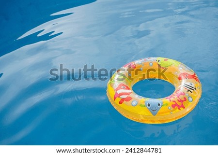 inflatable kids float in blue water pool