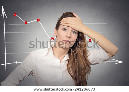Headshot depressed business woman looking stressed financial market chart graphic going down on grey office wall background. Poor economy mistake crisis meltdown loss concept. Face expression emotion Royalty-Free Stock Photo #241286893