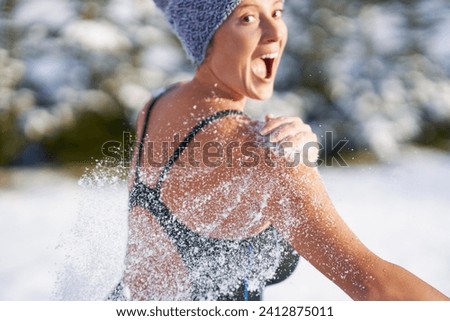 Picture of woman having fun on snow in winter