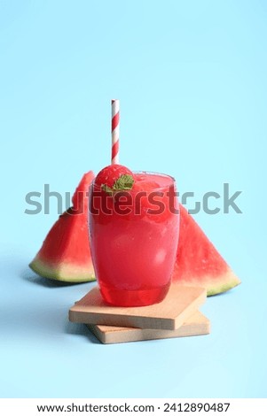 Glass of tasty watermelon fresh on blue background