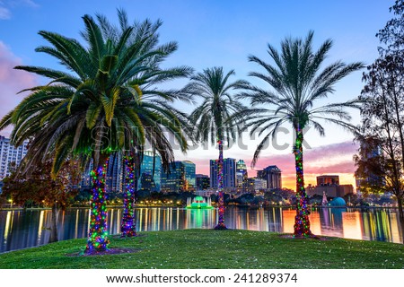 Orlando, Florida, USA downtown skyline at Eola Lake.