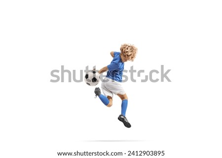 Boy kicking a football with backheel isolated on white background Royalty-Free Stock Photo #2412903895