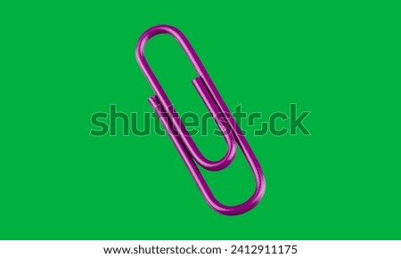 One single purple paper clip on green screen  Royalty-Free Stock Photo #2412911175