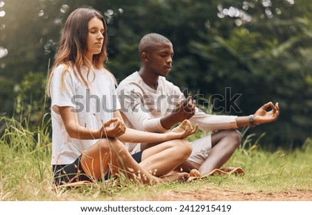 Forest yoga, nature meditation and couple in zen, relax or health mind training for energy wellness or peace. Interracial man or woman on floor in sustainability wood trees for mental health exercise