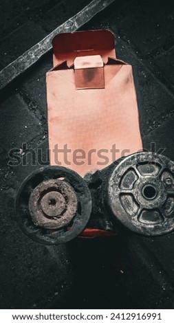 Mojokerto, Indonesia - January 15, 2024 : worn belt tensioner with paving block background Royalty-Free Stock Photo #2412916991