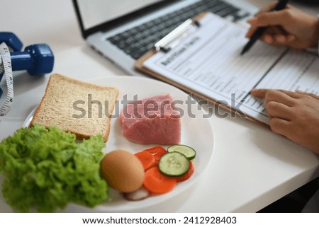 Nutritious food with fresh vegetable, meat and egg for healthy diet on white table Royalty-Free Stock Photo #2412928403