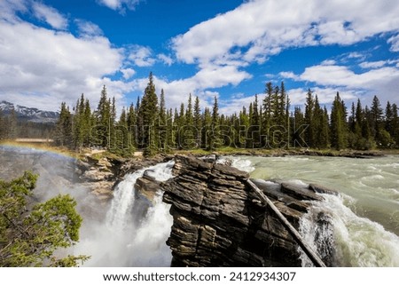 Summer in Athabasca Falls, Jasper National Park, in Canada. Royalty-Free Stock Photo #2412934307