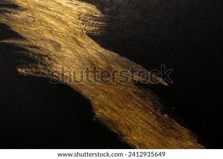 Background drawing with beautiful golden paint on black background