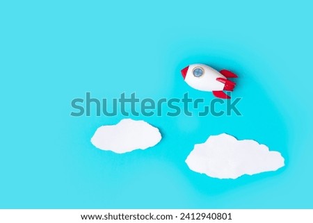 space rocket on the sky with clouds  , creative idea and start up concept 