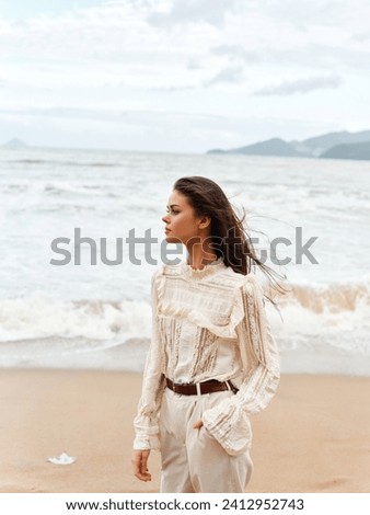 Summer Beauty: Young Woman with Long Brunette Hair Enjoying Beach Vacation by the White Sand Coastline