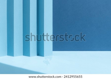 Abstract blue background for the presentation of a cosmetic product. A scene with a geometric backdrop. Podium for product promotion, beauty, natural eco cosmetic. Showcase, display case. Royalty-Free Stock Photo #2412955655