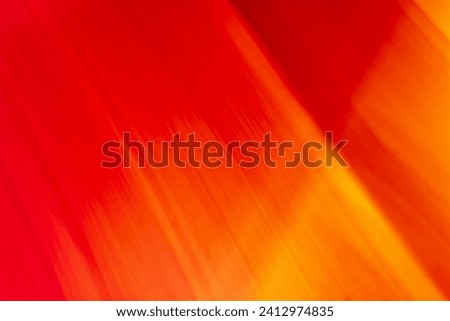 Bright colored blurry strokes and waves in the form of red and orange lines. Abstract background. Place for copy space. Backdrop Royalty-Free Stock Photo #2412974835