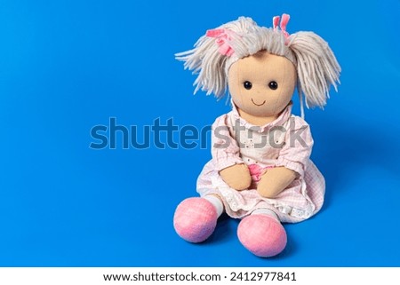 Isolated old doll toy for a child Royalty-Free Stock Photo #2412977841