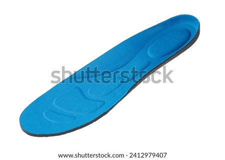 Inner insole of sports shoes on a white background. Royalty-Free Stock Photo #2412979407