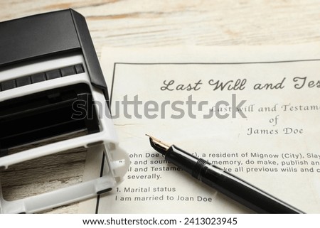 Last Will and Testament, stamp and pen on white wooden table, closeup