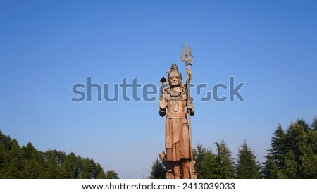 big statue of god shiv holding trishul Royalty-Free Stock Photo #2413039033