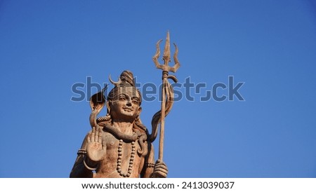 statue of god shiv holding trishul closeup shot Royalty-Free Stock Photo #2413039037