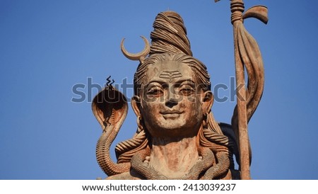 face statue of god shiv holding trishul Royalty-Free Stock Photo #2413039237