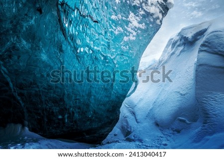 Ice Cave Background. Magnificent Glacier Formation. Gorgeous Beauty of Icelandic Nature. Skaftafell. Vatnajokull. Iceland Royalty-Free Stock Photo #2413040417