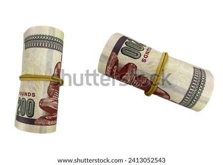2 piles of 200 Egyptian pounds isolated on white background- 2 rolled stacks of 200 EGP - two rolled up money stacks - 200 LE Royalty-Free Stock Photo #2413052543