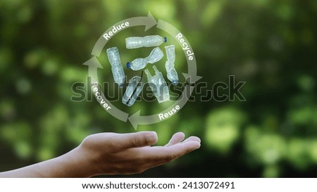 Plastic bottles and plastic bags on the palm Concepts of reduce, reuse, recycle and recover. world environment day and zero waste disposal Ecological waste management Royalty-Free Stock Photo #2413072491