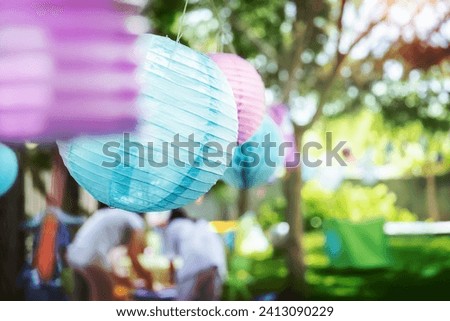 Decorations for outside event, colorful paper balloons, happy children's birthday party in sunny day on backyard, happy life