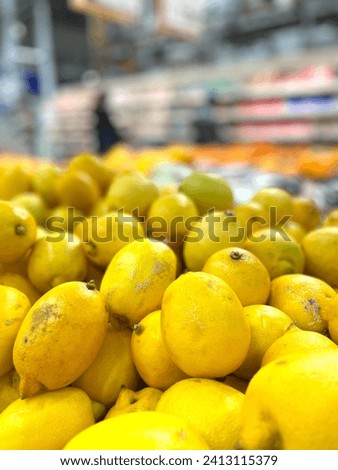 Lemons in supermarket , sale of fruit Royalty-Free Stock Photo #2413115379