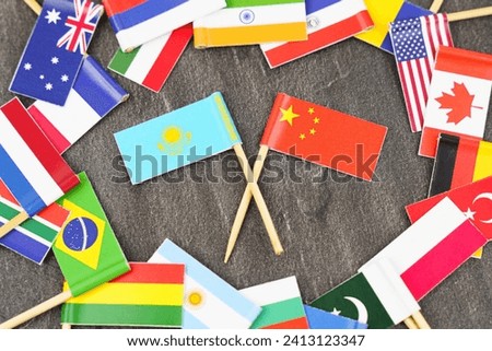 Policy. National flags of different countries. The concept is diplomacy. In the middle among the various flags are two flags - China, Kazakhstan
