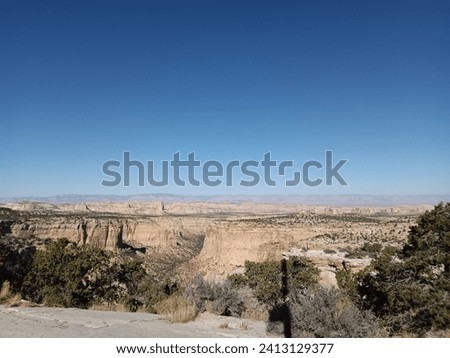 Landscape shot of the steppe in the Utah badlands - Outlaw Country  Royalty-Free Stock Photo #2413129377
