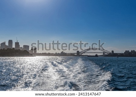 Skyline of Sydney with Opera House and Harbor Bridge seen from the Sea, New South Wales, Australia.
