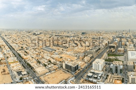 Aerial large panorama of downtown and outskirts of Riyadh city, Al Riyadh, Saudi Arabia Royalty-Free Stock Photo #2413165511