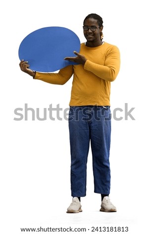 A man in a yellow sweater on a White background holds a blue comment sign