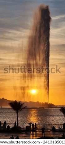 Fountain in the Red Sea, Middle East sunset in the background, Saudi Arabia, vertical photo.
