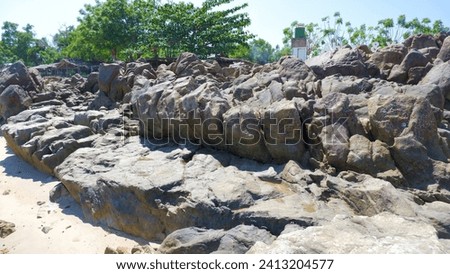 Large Stones, Naturally Arranged On The Tropical Coast Of Tanjung Kalian, Indonesia