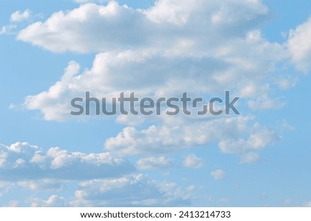 Blue sky with white clouds, tranquil blue trend color, pastel colored cloudscape. Fluffy heaven pattern. Beautiful Cloudy background, nature environment backdrop, wallpaper, phone screensaver