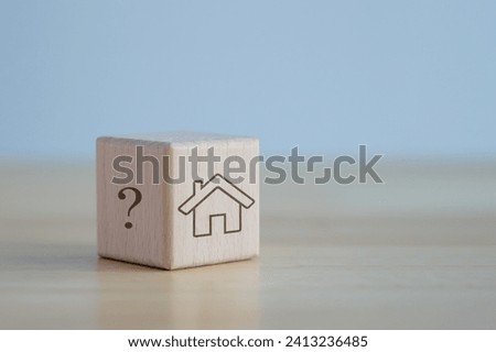 Question mark and house on wooden blocks. Decision to choose the best property. Checklist for transfer ownership of land, Home loan, Financial and banking, Real estate investment and asset management.