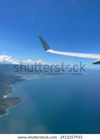 Photo taken from an airplane on a nice day outside the window
