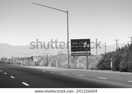 Car Sign notifying about Entering Pacific Time, Interstate-10, Blyth, California. Black and White