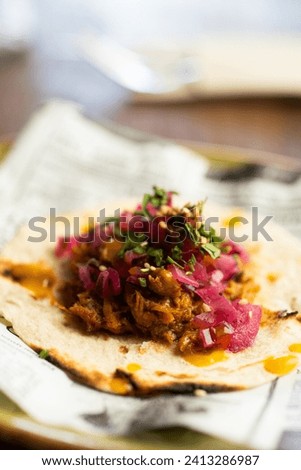 Appetizing cochinita pibil tacos with tortilla
