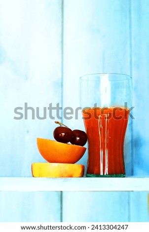 This is a photo of fruits and orange juice