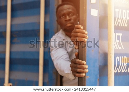 Trafficking of Black african Country Smuggling in cargo container, Citizens Refugees Transnational Migration Victims Migrant. Royalty-Free Stock Photo #2413315447