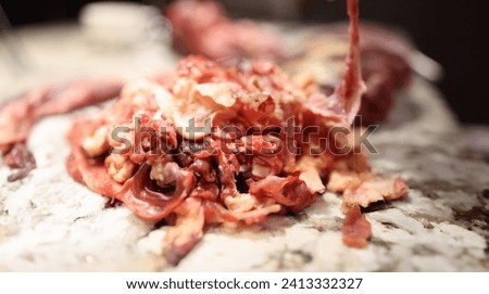 Closeup of substandard meat scraps for animal feed production. Deboning of meat concept Royalty-Free Stock Photo #2413332327