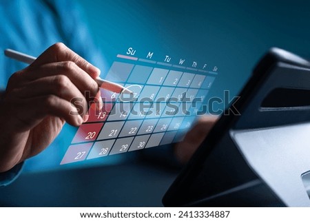 Secretary use tablet and touch virtual calendar screen. Make appointment or reminder for meeting agenda on the calendar. Time management concept. Businessman manages schedule for time-effective work.