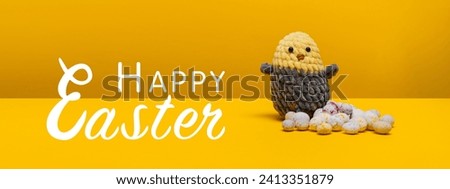 Knitted chicken with Easter eggs on a yellow background. Happy Easter. banner, greeting card.