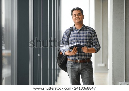 Portrait of cheerful male international Indian student with backpack. Education concept.
