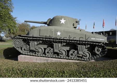 The Grizzly I was a Canadian-built M4A1 Sherman tank with relatively minor modifications, primarily to stowage and pioneer tool location and adding accommodations for a Number 19 radio set. Royalty-Free Stock Photo #2413385451
