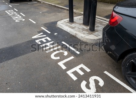A newly installed charging point in a suburb of London, UK, with parking bays marked for electric vehicles only.